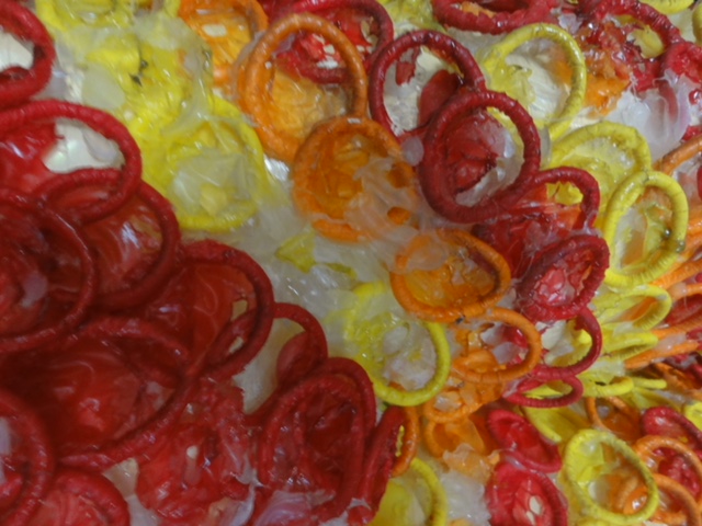 Close up of colourful red and yellow condoms