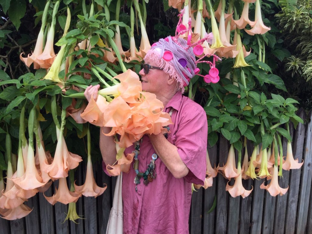 Pink hat and trumpet flowers